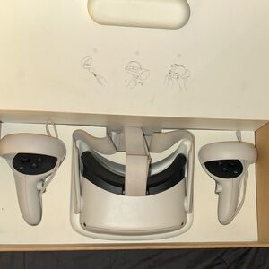 Oculus Quest 2; Includes headset, both controllers, and original box it came in.